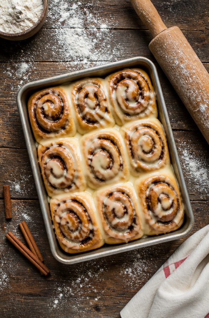 Fall Baking Desserts: 15 Recipes for Pumpkin, Apple and Pecan 8 Yeasted cinnamon rolls with a golden-brown top on a cooling rack.