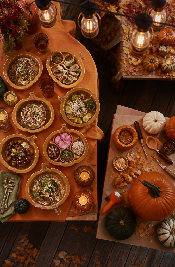 Pumpkin-shaped bamboo plates arranged on a table.