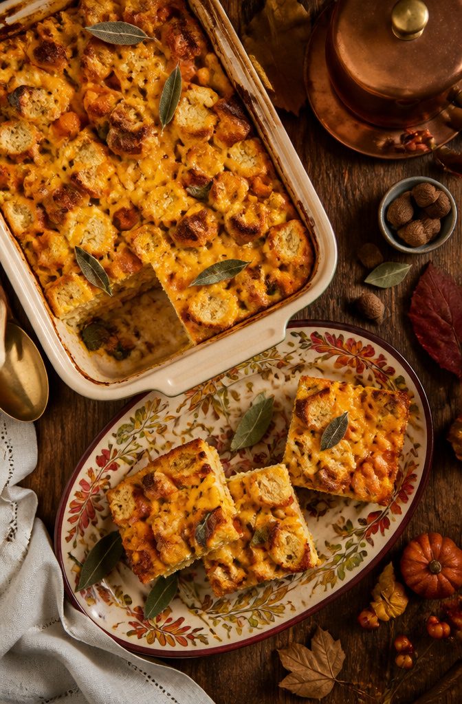 20 Thanksgiving Dinner Main Dishes for 2026 9 A golden pumpkin and cheddar strata on a serving dish.