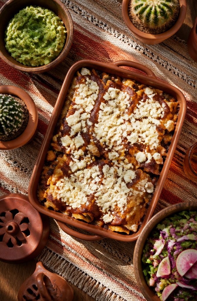 20 Thanksgiving Dinner Main Dishes for 2026 15 A baking dish of vegetarian enchiladas topped with sauce.